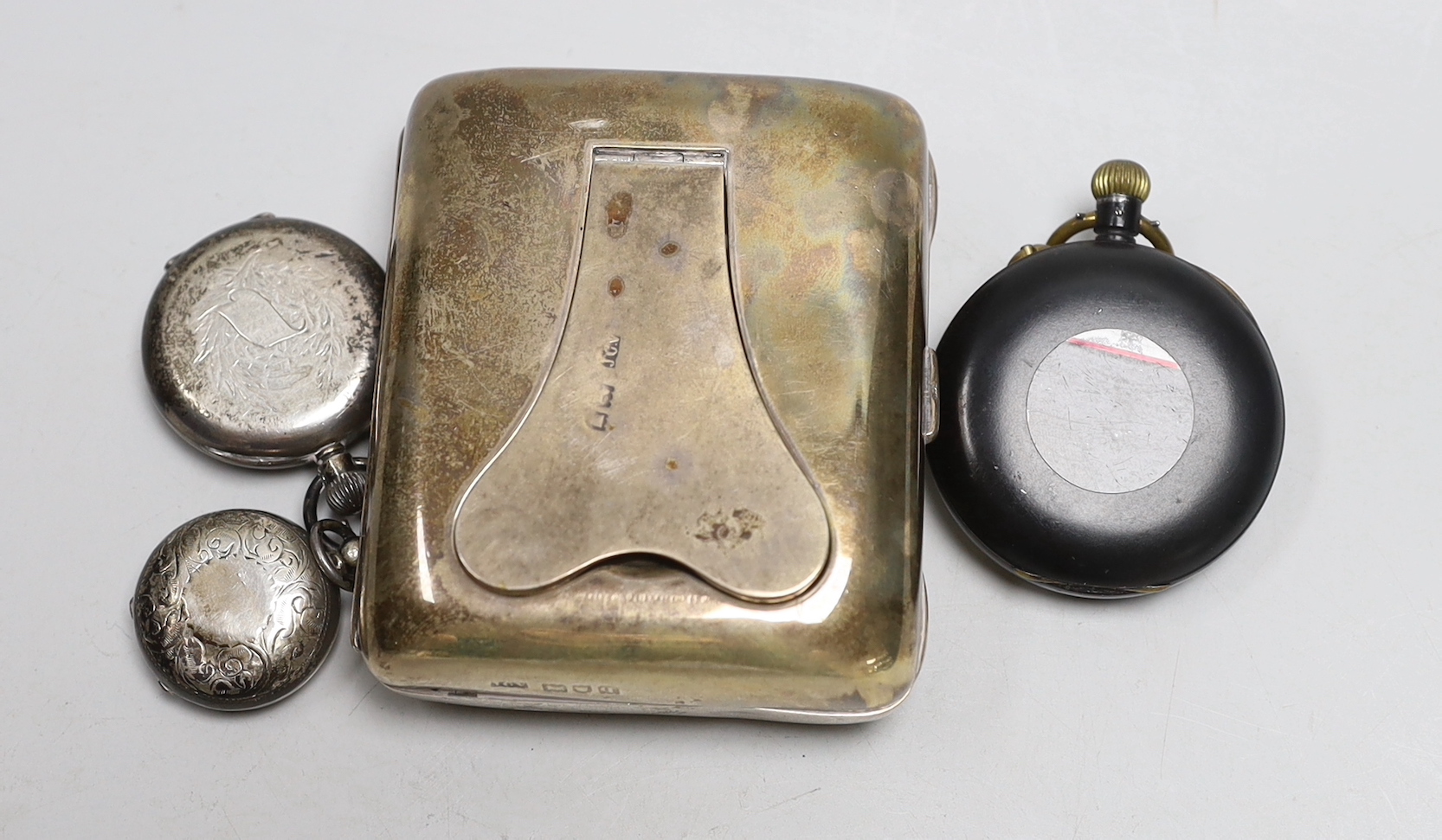 An Edwardian silver sovereign case, Birmingham, 1914, a George V silver travelling pocket watch case, with nickel cased pocket watch and two other pocket watches including gun metal chronograph.